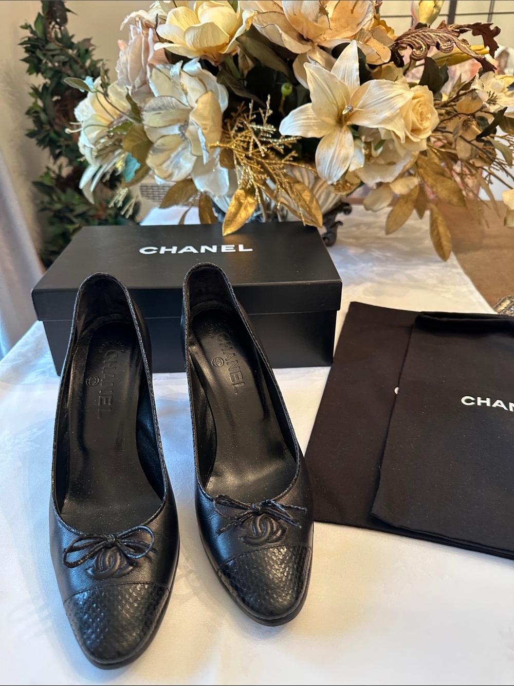 CHANEL Black Leather Cap-Toe Bow Heels